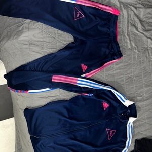Adidas human race track suit
